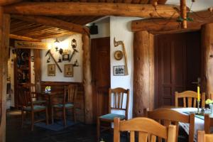 a dining room with tables and chairs in a building at Doppelzimmer-in-Wiesa in Thermalbad Wiesenbad