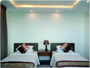 Cama o camas de una habitación en Kyaik Hto Hotel - The Golden Rock Pagoda