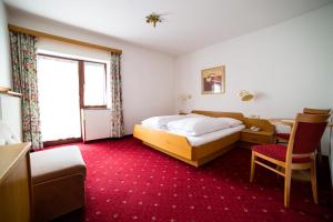Postel nebo postele na pokoji v ubytování Langley Hotel Rendlhof