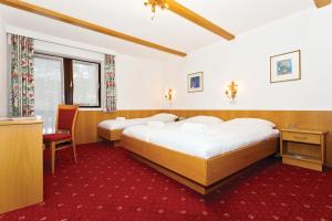 Posteľ alebo postele v izbe v ubytovaní Langley Hotel Rendlhof