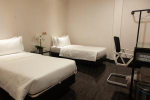 Katil atau katil-katil dalam bilik di M Design Hotel @ Taman Pertama