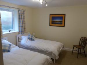 The Woodshed - A newly built, 2 bedroom, cottage near Glastonbury客房内的一张或多张床位