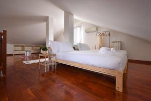 מיטה או מיטות בחדר ב-Welc-om Romantic Flat