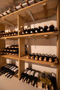 a bunch of wine bottles on shelves in a cellar at VİNO ALAÇATI in Alaçatı