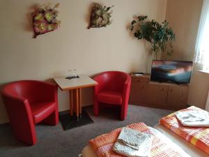 TV a/nebo společenská místnost v ubytování Hotel Arkona + 4 fotografie