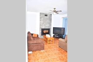 A television and/or entertainment centre at TPA - Les Tres Cales - 1