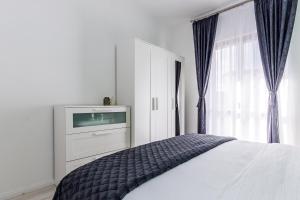 Postel nebo postele na pokoji v ubytování Apartments Tanya