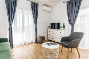 TV a/nebo společenská místnost v ubytování Apartments Tanya