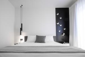 A bed or beds in a room at The H Experience Boutique Apartment Koules Fortress Heraklion