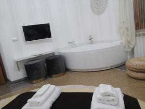 TV a/nebo společenská místnost v ubytování Babbo maison