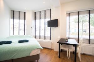 Ένα ή περισσότερα κρεβάτια σε δωμάτιο στο Escamp Apartments