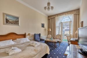 Postel nebo postele na pokoji v ubytování Hotel Romance