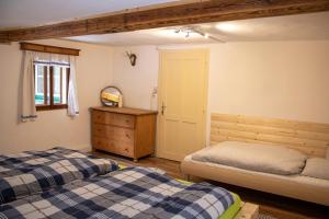 A bed or beds in a room at Haus Waldbach