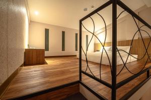 Letto o letti in una camera di Yunoyado Onsen Hot Spring Hotel Deyang