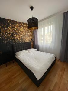 Katil atau katil-katil dalam bilik di Apartament F&J #35