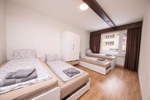 Postel nebo postele na pokoji v ubytování Haus Astoria