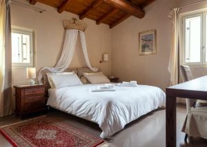 En eller flere senge i et værelse på Corte dei Soavi