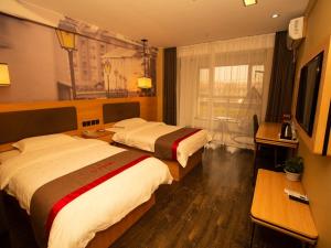 Posteľ alebo postele v izbe v ubytovaní Thank Inn Plus Hotel hebei hengshui taocheng district people's west road