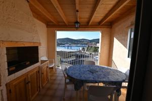 a balcony with a table and a view of the water at superbe duplex bord de mer in Port-Vendres
