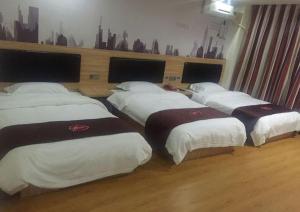 Postel nebo postele na pokoji v ubytování Thank Inn Chain Hotel jiangxi nanchang gaoxin district gaoxin avenue metro station