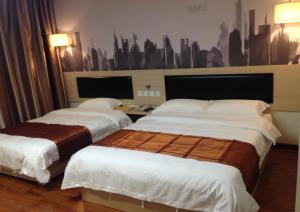 Krevet ili kreveti u jedinici u objektu Thank Inn Chain Hotel henan luohe liaohe road denis square