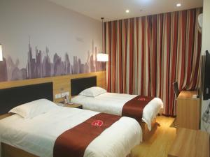 Katil atau katil-katil dalam bilik di Thank Inn Chain Hotel jiangsu xuzhou xinyi nanjing road