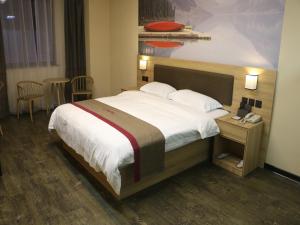 En eller flere senger på et rom på Thank Inn Chain Hotel jiangsu taizhou hailing district yingchun road