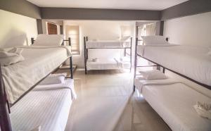 a group of bunk beds in a room at Wonderland Healing Center in Thongsala