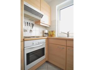 Kuchyň nebo kuchyňský kout v ubytování Ferienwohnung Duenenweg _ Haase