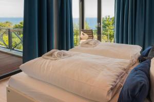 Postel nebo postele na pokoji v ubytování Villa Claire Ocean Blue