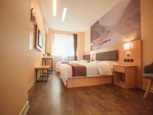 En eller flere senge i et værelse på Thank Inn Chain Hotel Shanxi linfen YaoDou zone pingyang north street