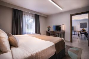 En eller flere senge i et værelse på Marbella Resort