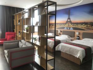 a bedroom with two beds and a room with the eiffel tower at Thank Inn Chain Hotel hebei handan yongnian district development road in Handan