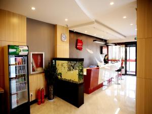 a restaurant with a fish tank in a store at Thank Inn Chain Hotel henan luoyang high-tech district jiudu west road zhoushan station in Luoyang