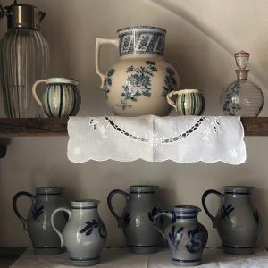 a shelf filled with vases on top of a shelf at AgroPobitzer in Malles Venosta