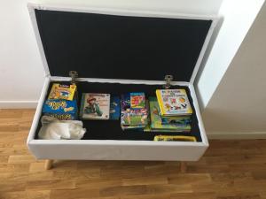 a drawer filled with childrens books and toys at Apartamento Turístico El Enclave in Olite