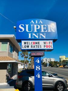 a sign for a aza super inn on a street at A 1 A Super Inn in Ormond Beach