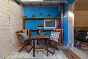 a table and two chairs on a patio at La casa di Giò - Bio Appartamento in Osimo
