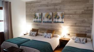 Ein Bett oder Betten in einem Zimmer der Unterkunft Caserio de Iznájar