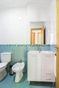 Koupelna v ubytování Apartamentos Montedunas + 37 fotografií