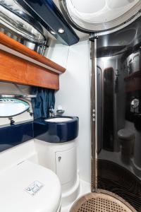 a bathroom in an rv with a toilet and a sink at Ionian View Yachts in Zakynthos