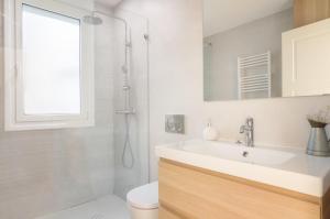 a bathroom with a sink and a shower at MODERN LOVELY HOUSE GUGGENHEIM in Bilbao +23 photos