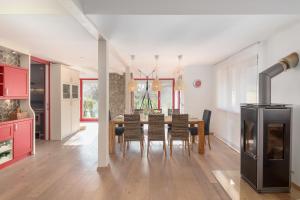 a kitchen and dining room with a table and chairs at Apartma Natura in Bled