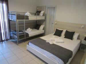 Postel nebo postele na pokoji v ubytování Hotel Zefyros