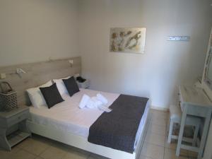 Postel nebo postele na pokoji v ubytování Hotel Zefyros
