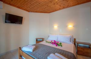 Postel nebo postele na pokoji v ubytování Aggelika Apartments