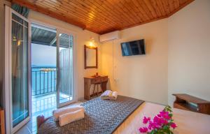 Postel nebo postele na pokoji v ubytování Aggelika Apartments