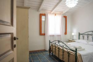 Postel nebo postele na pokoji v ubytování Agriturismo Agrimaccari Marzamemi-Vendicari - Esperienza autentica siciliana
