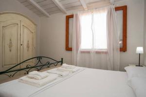 Postel nebo postele na pokoji v ubytování Agriturismo Agrimaccari Marzamemi-Vendicari - Esperienza autentica siciliana