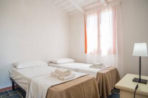 Postel nebo postele na pokoji v ubytování Agriturismo Agrimaccari Marzamemi-Vendicari - Esperienza autentica siciliana